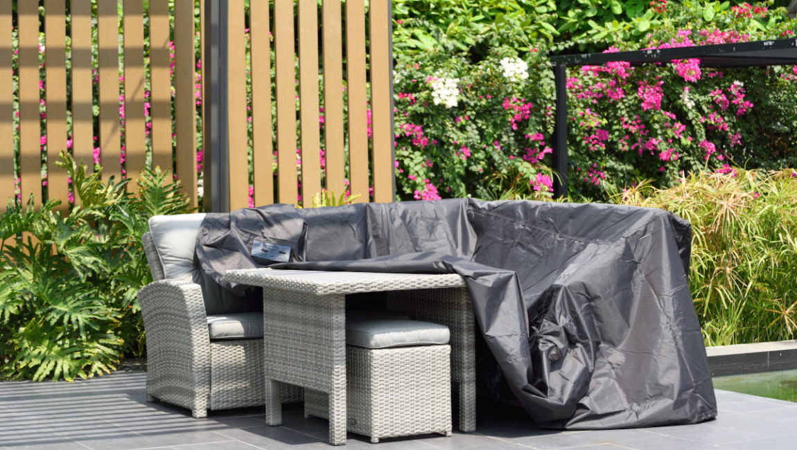 Outdoor furniture covered with furniture cover.